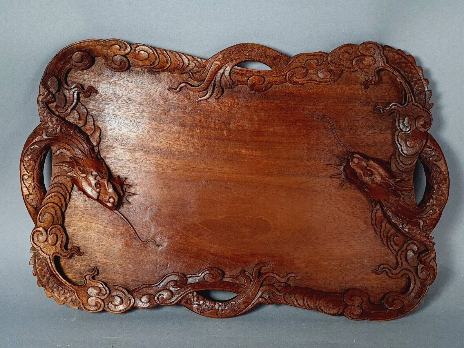 Ancient wooden tray carved with Chinese dragons around 1900