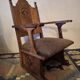 Antique Gothic Revival carved oak armchair, 1910