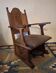 Antique Gothic Revival carved oak armchair, 1910