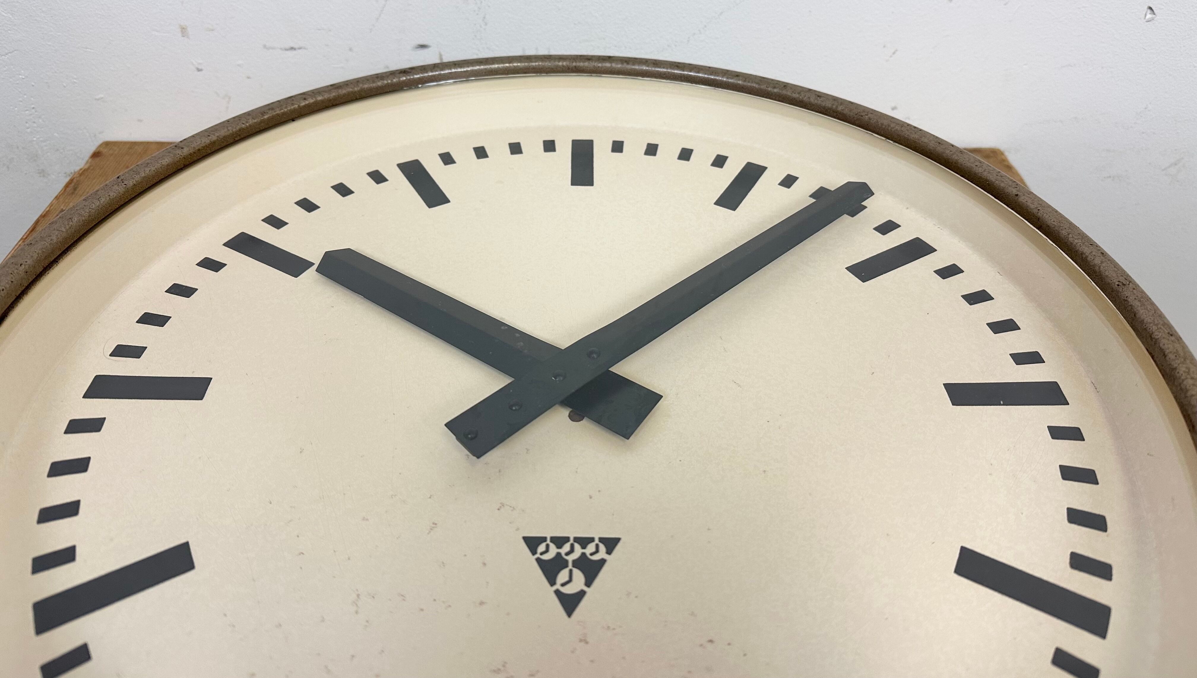Brown industrial factory wall clock from Pragotron, 1960s