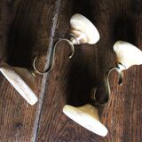 Pair of curved brass candlesticks with onyx