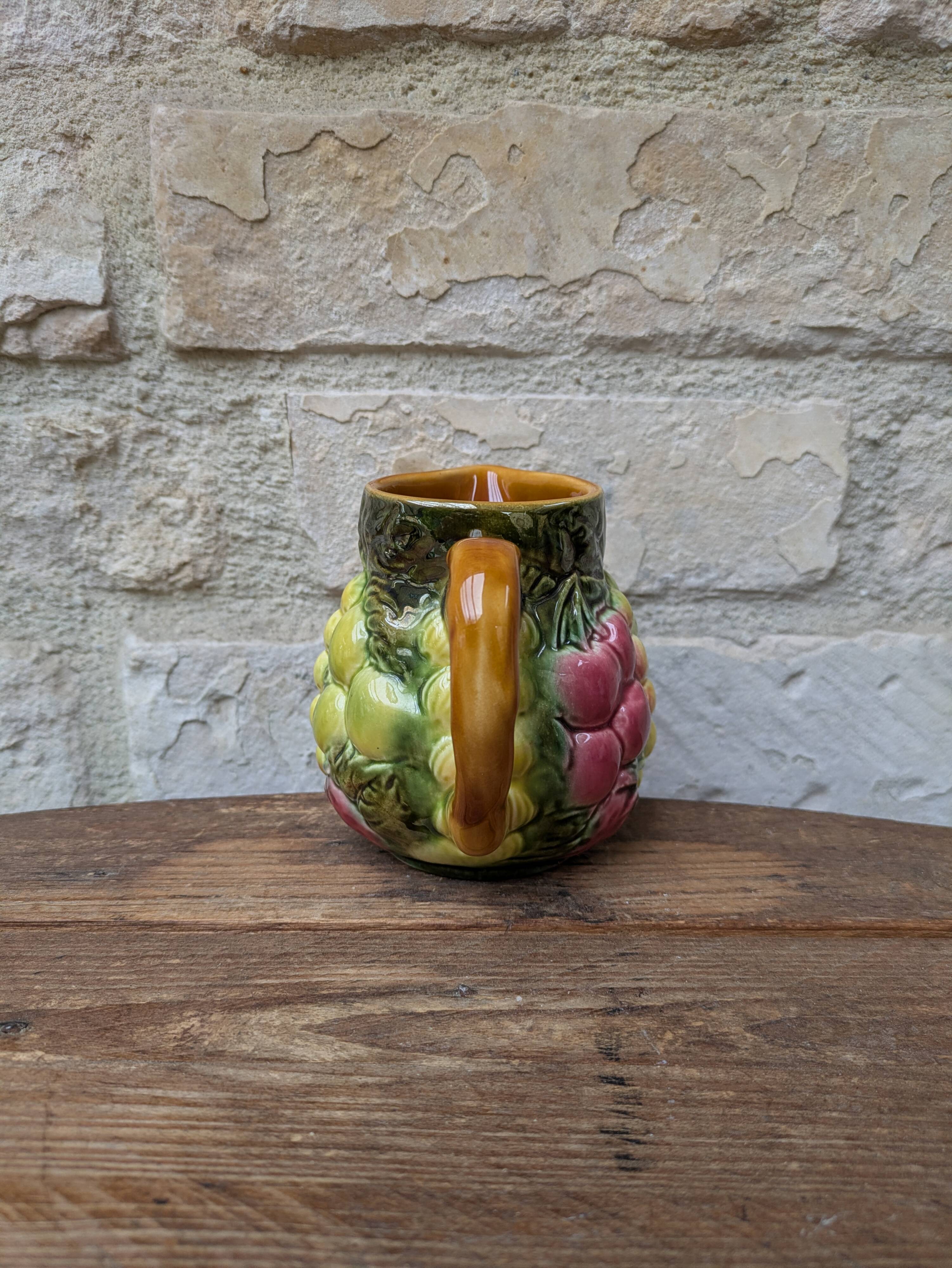 Small jug, milk pot in slipware with relief fruits Salins les Bains