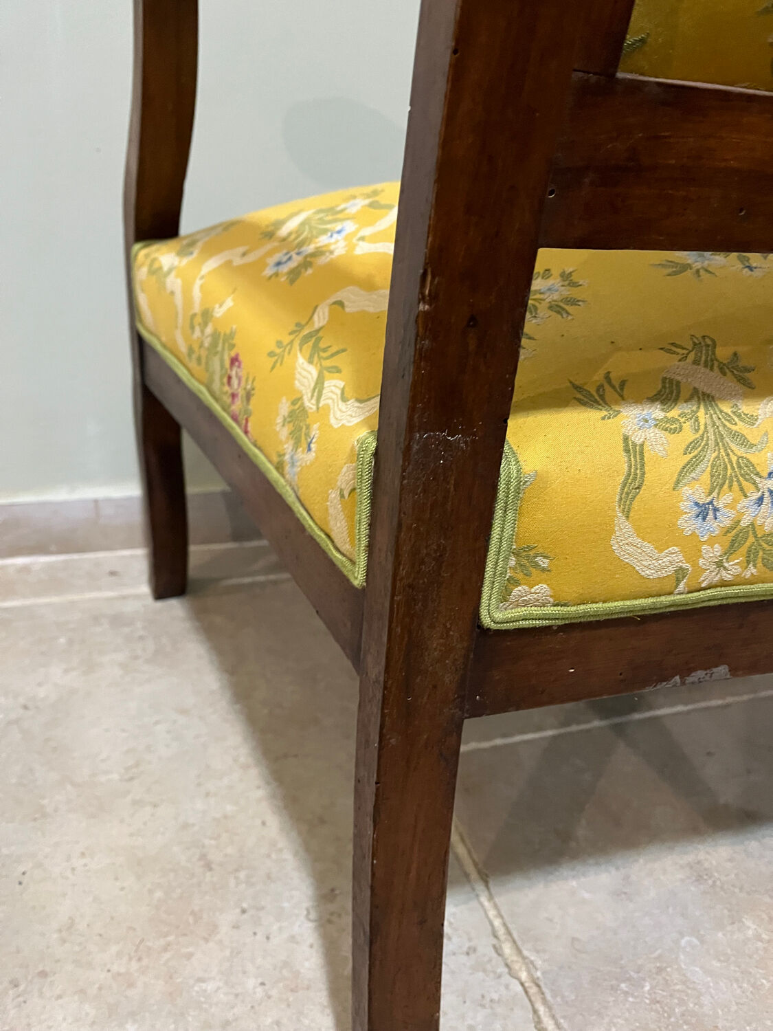 Louis XV style cabriolet armchair in solid wood, yellow floral fabric.