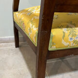 Louis XV style cabriolet armchair in solid wood, yellow floral fabric.