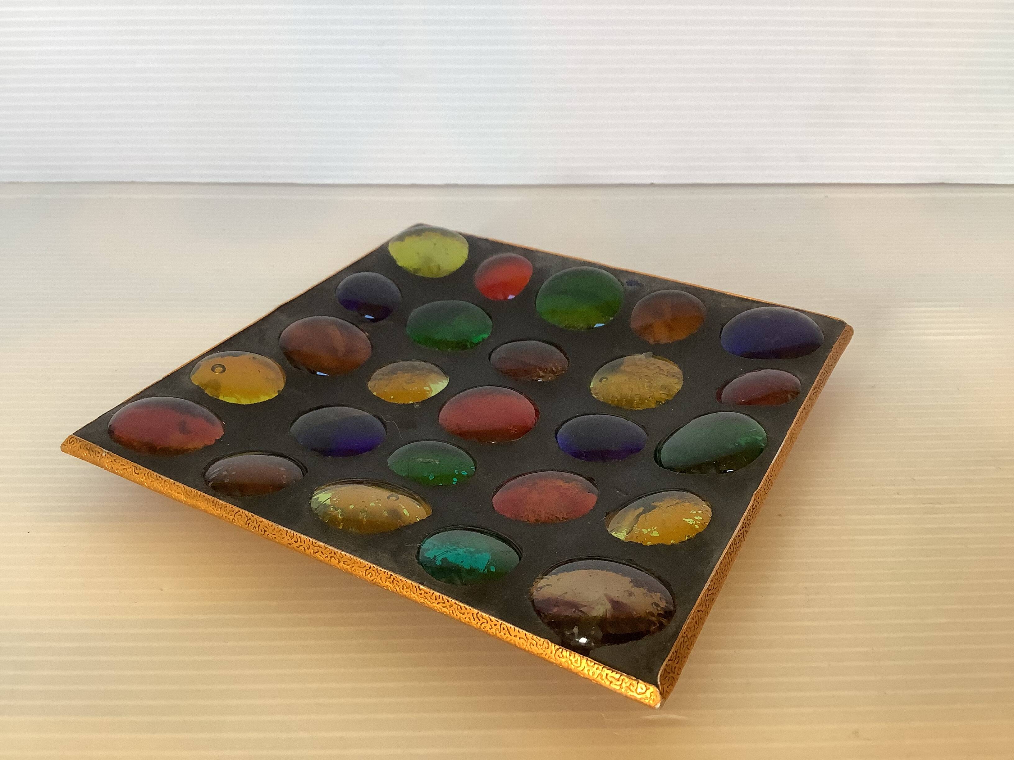 Empty pocket of multicolored glass pellets