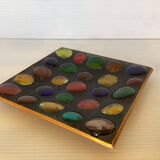 Empty pocket of multicolored glass pellets