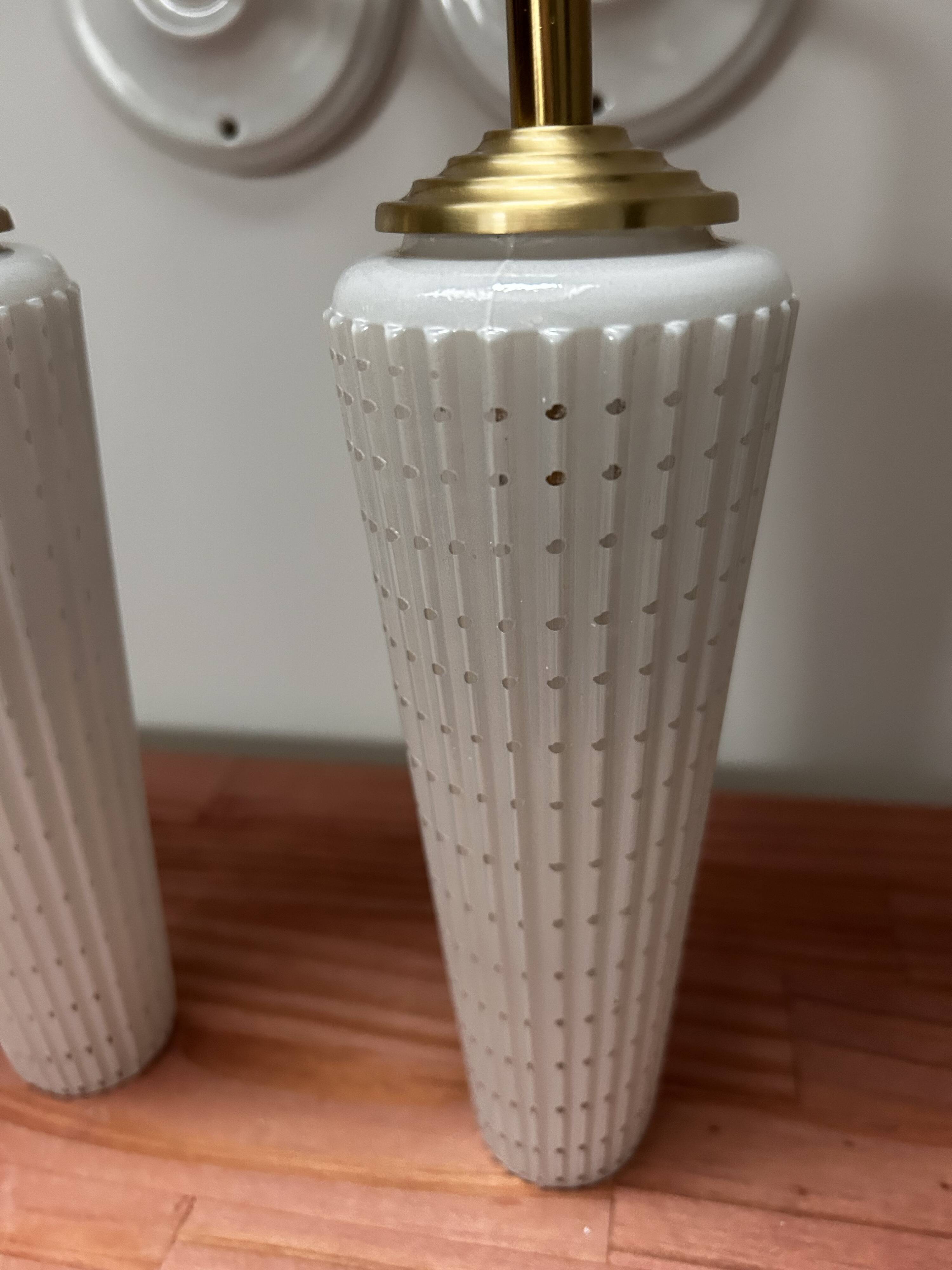 Pair of white and gold wall sconces