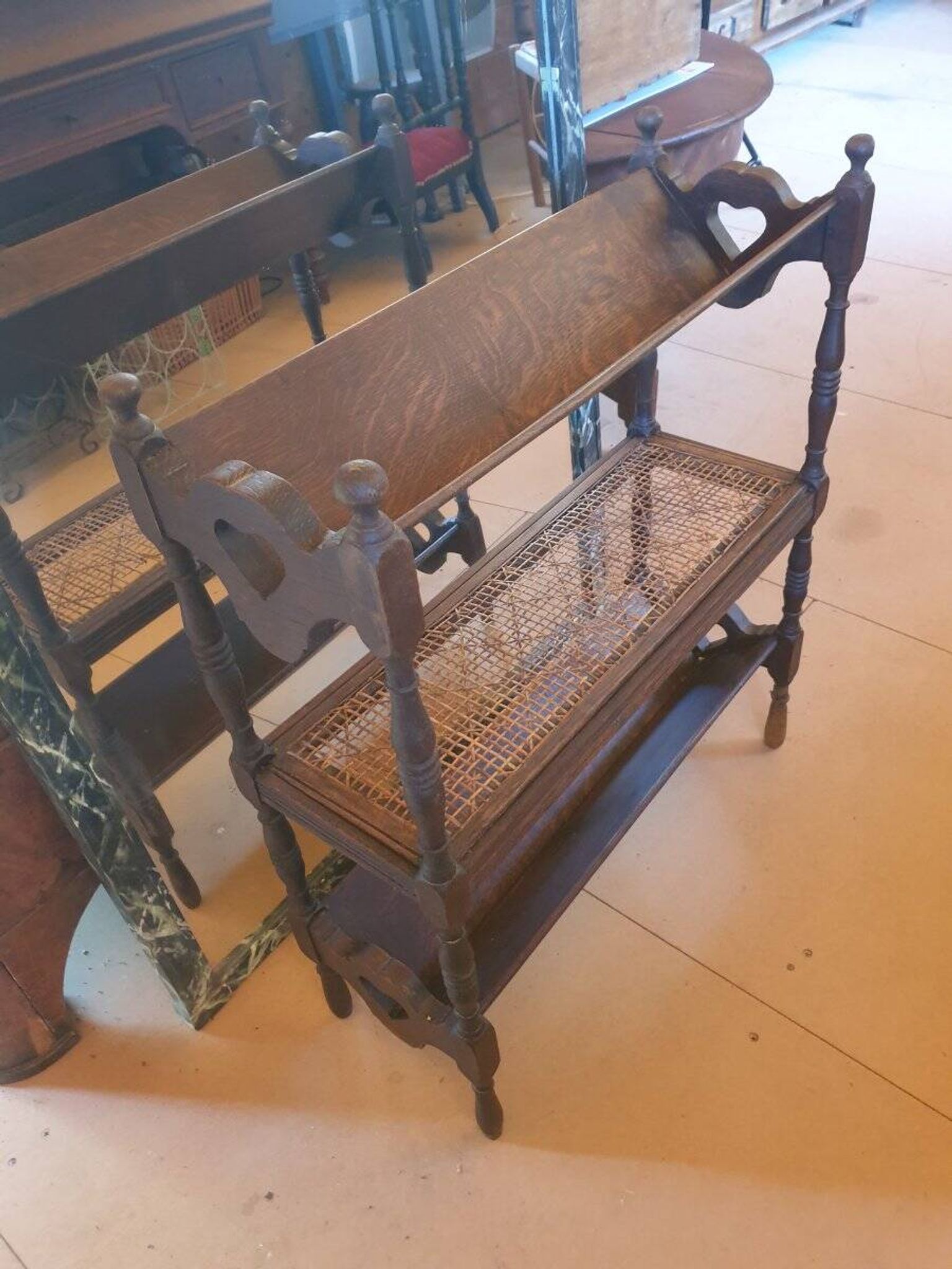 Magazine/book rack in oak with a caned top - early 20th century
