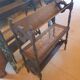 Magazine/book rack in oak with a caned top - early 20th century