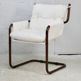 Tubular armchair, fabric suspended seat. Circa 1970