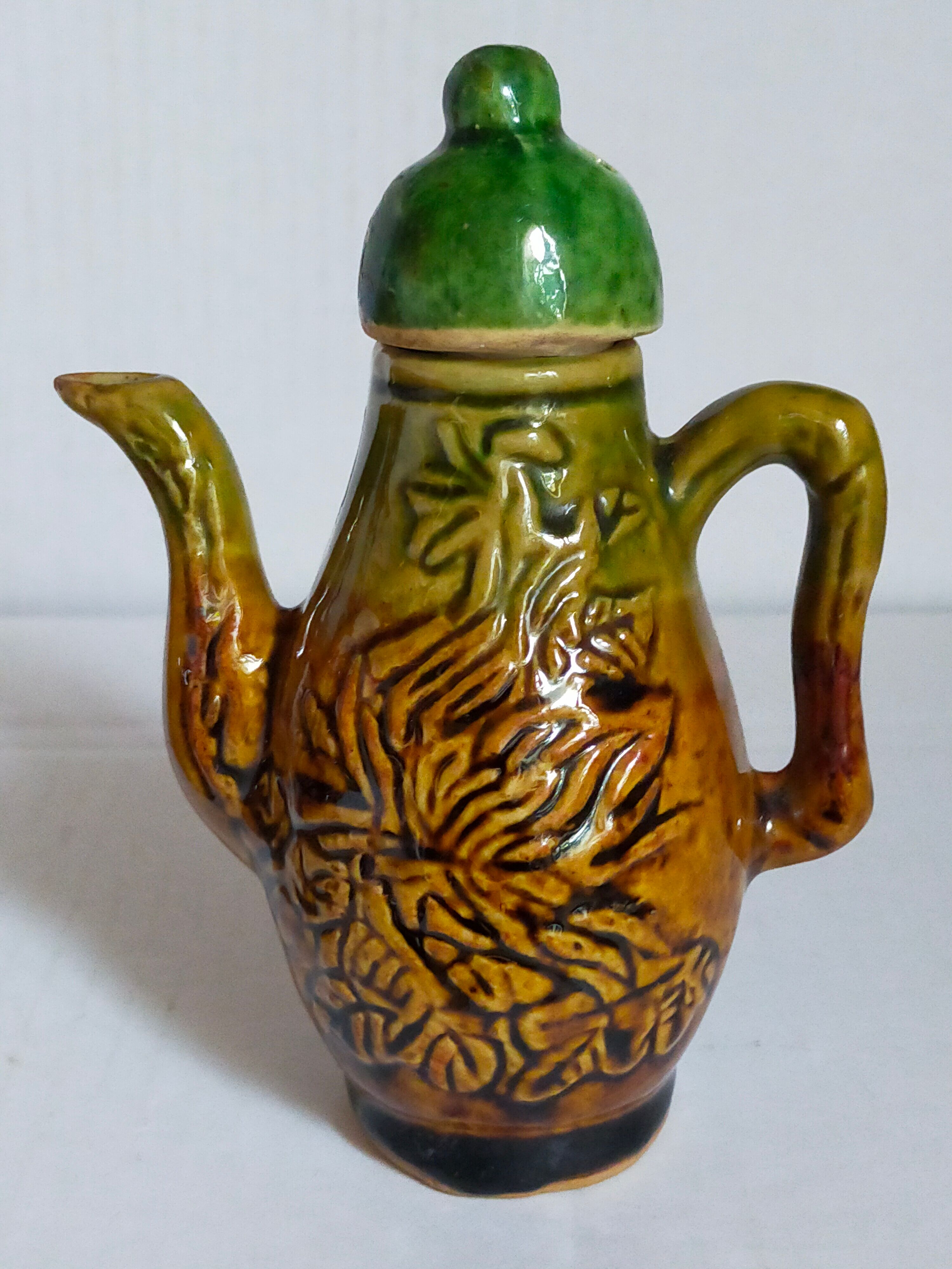 Set of old teapots and honey pot