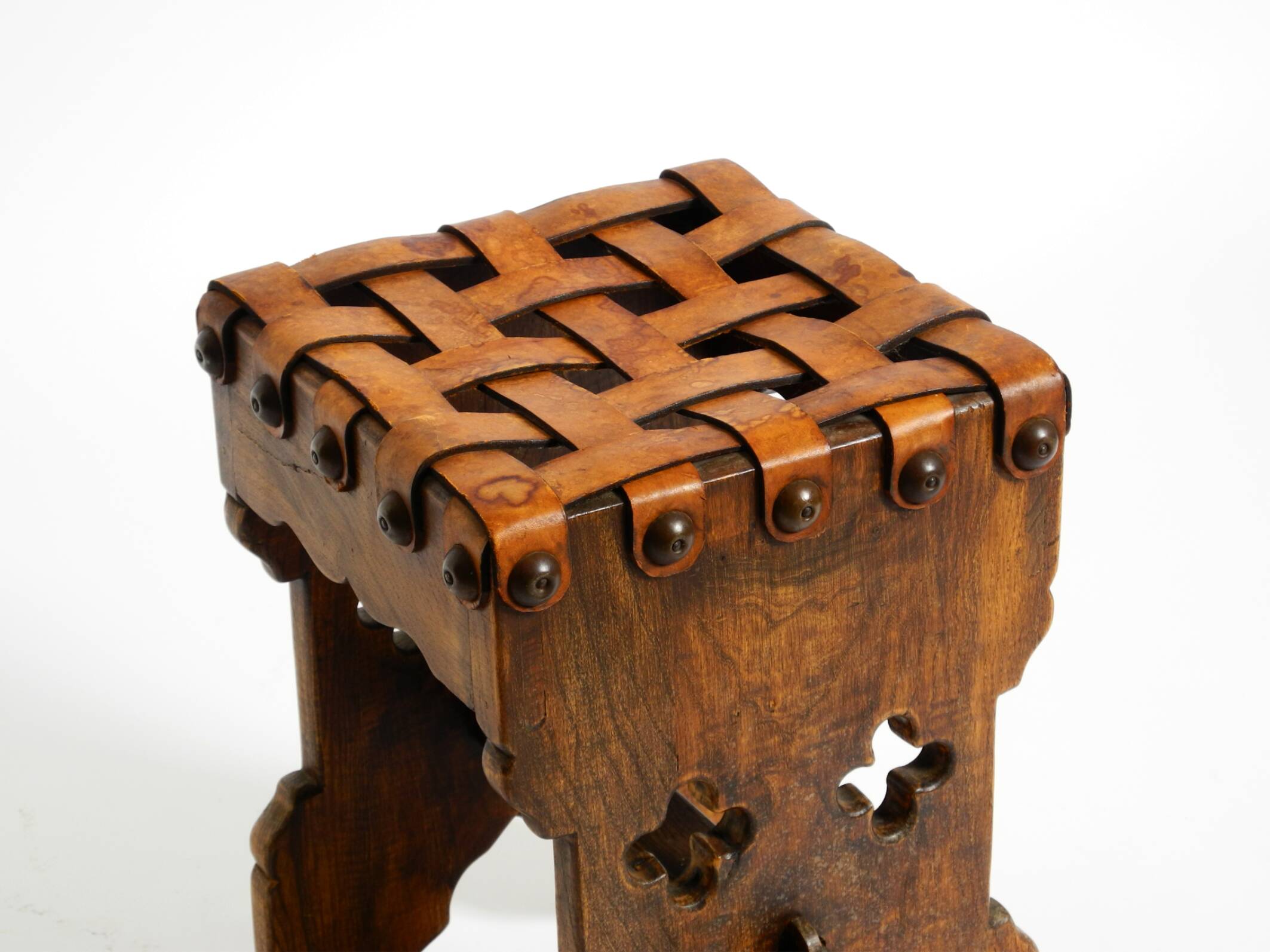 Beautiful 1940s oak stool with a seat made of leather straps