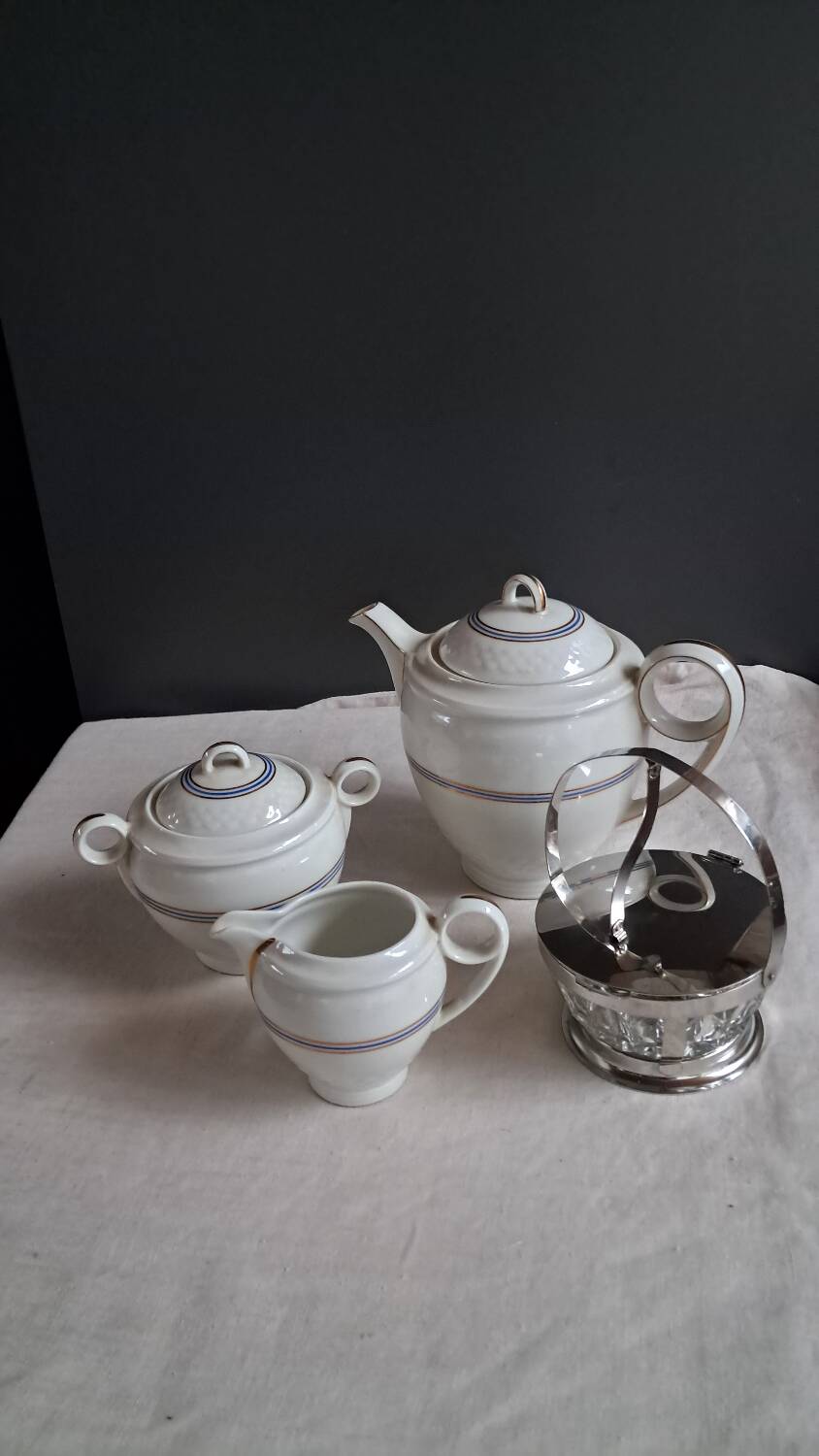 Teapot, sugar bowl, milk jug, jam jar.