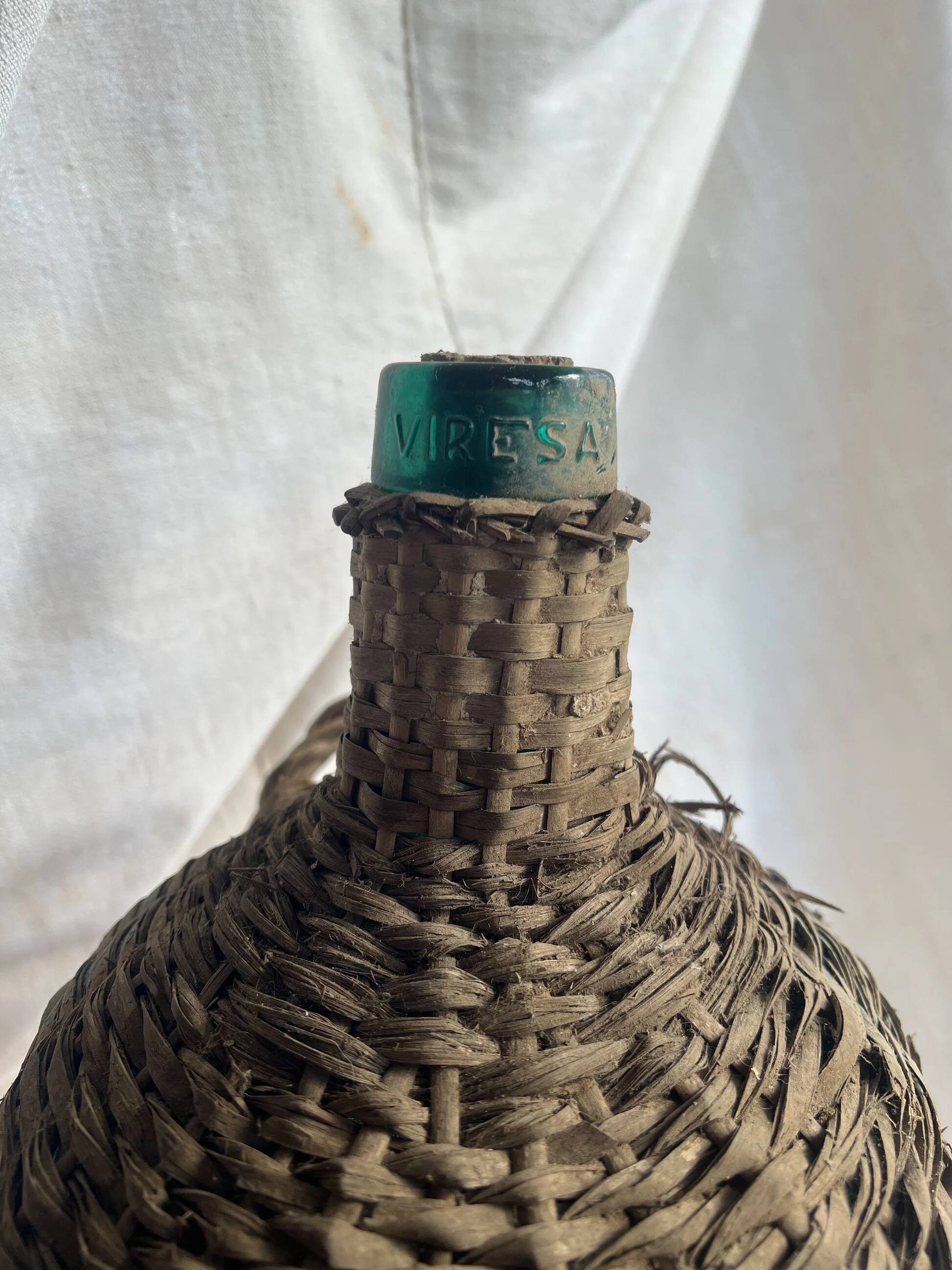 Vintage Spanish wicker demijohn bottle
