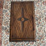 Low stool in carved wood