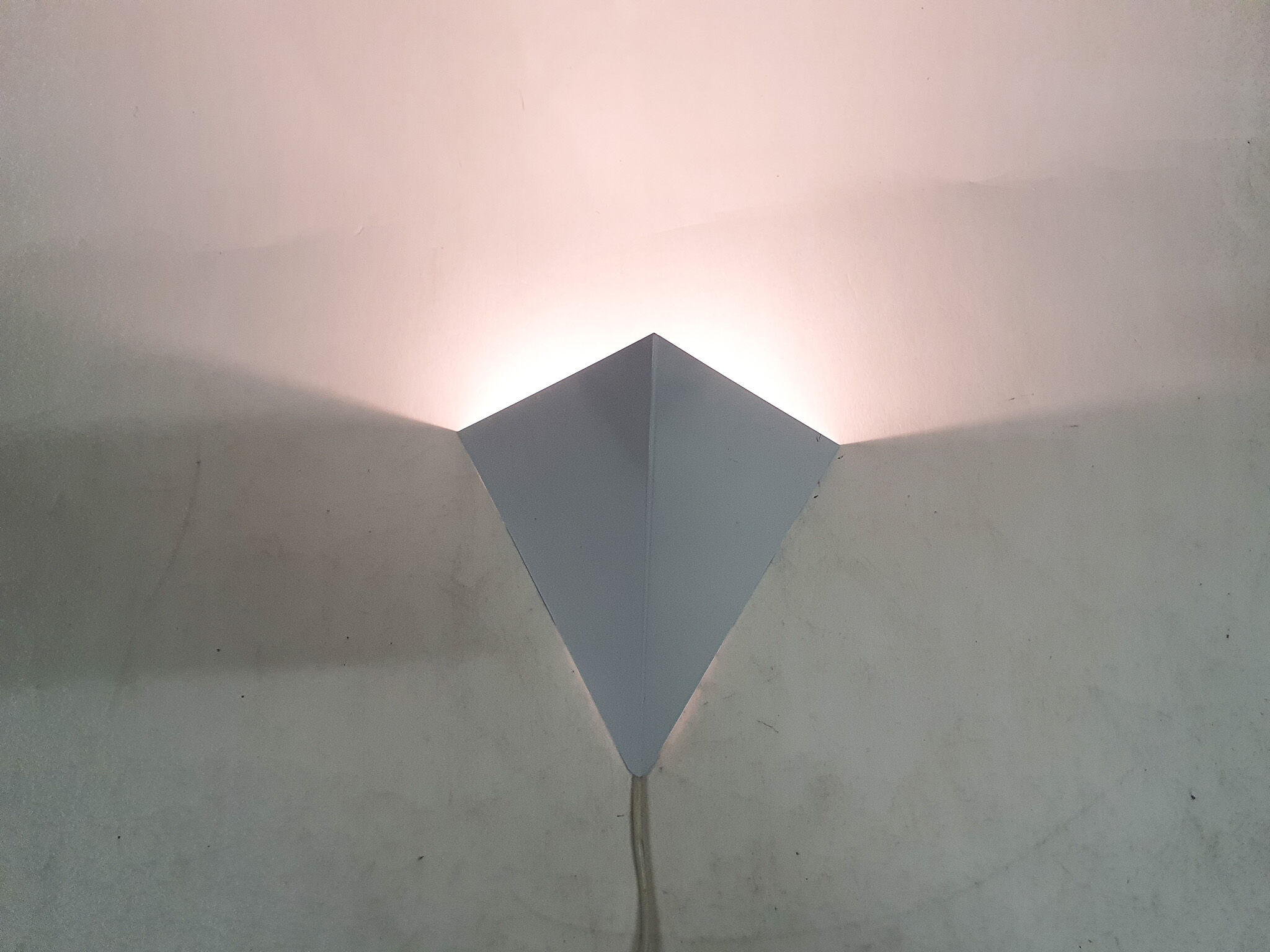 White metal wall light in good condition. By Anvia, The Netherlands.