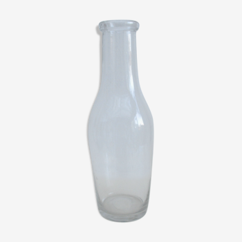 Large antique bottle made of blown glass