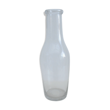 Large antique bottle made of blown glass