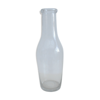 Large antique bottle made of blown glass