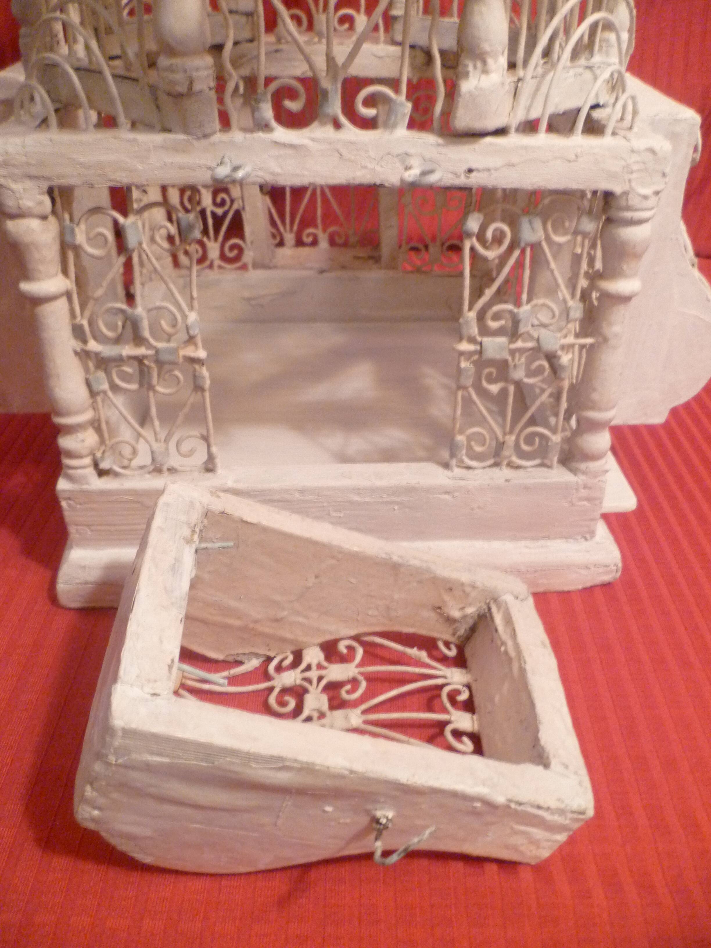 Antique handmade birdcage in metal and wood