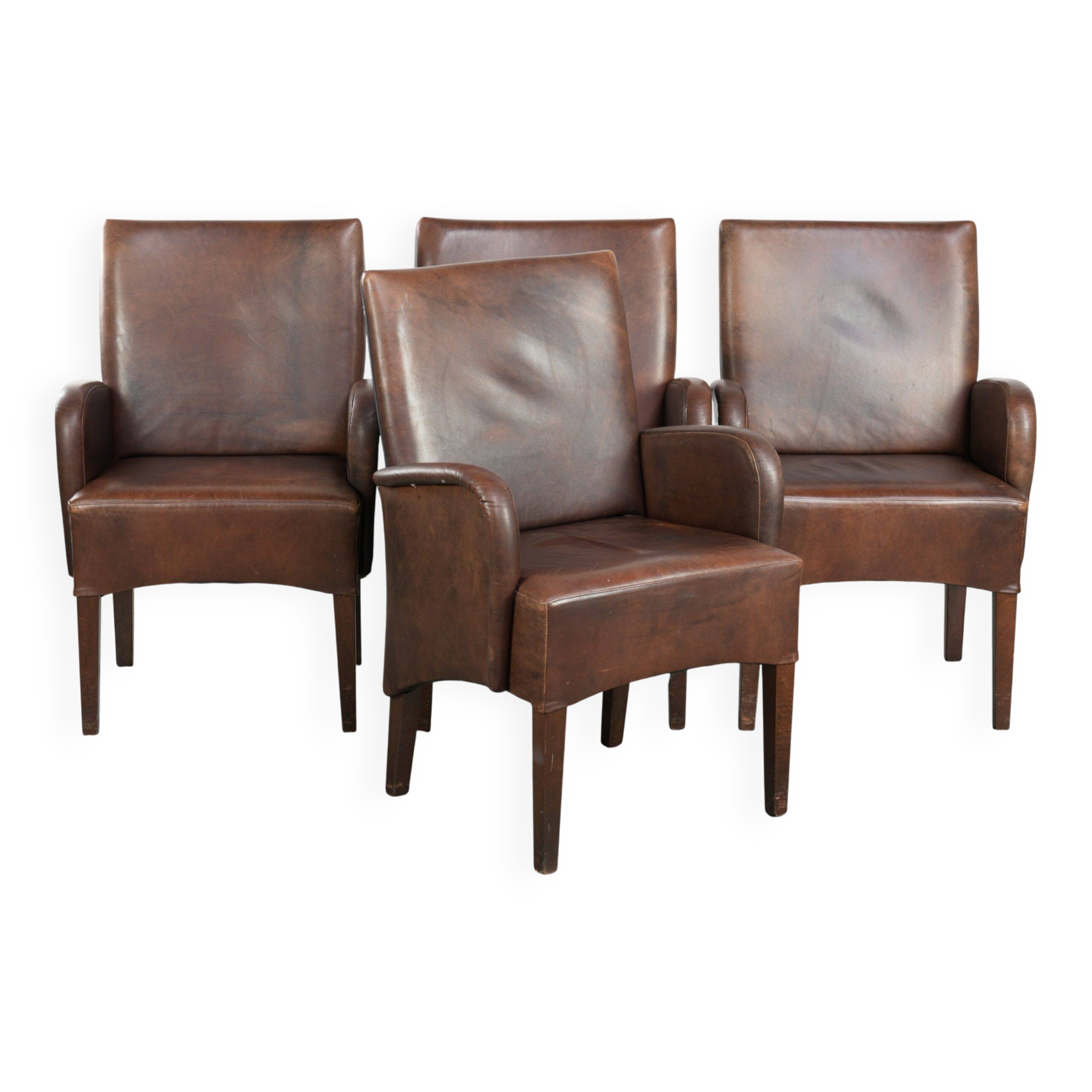 Set of 4 nicely finished dining chairs/side chairs with armrests made of cowhide leather