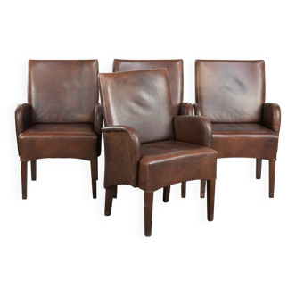 Set of 4 nicely finished dining chairs/side chairs with armrests made of cowhide leather