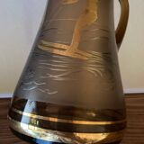 Vintage smoked glass carafe with gold from the 50s/60s, featuring a marine and water skiing design.