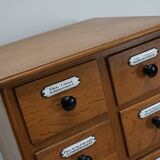 German Oak Apothecary Cabinet with Enamel Shields, 1940s
