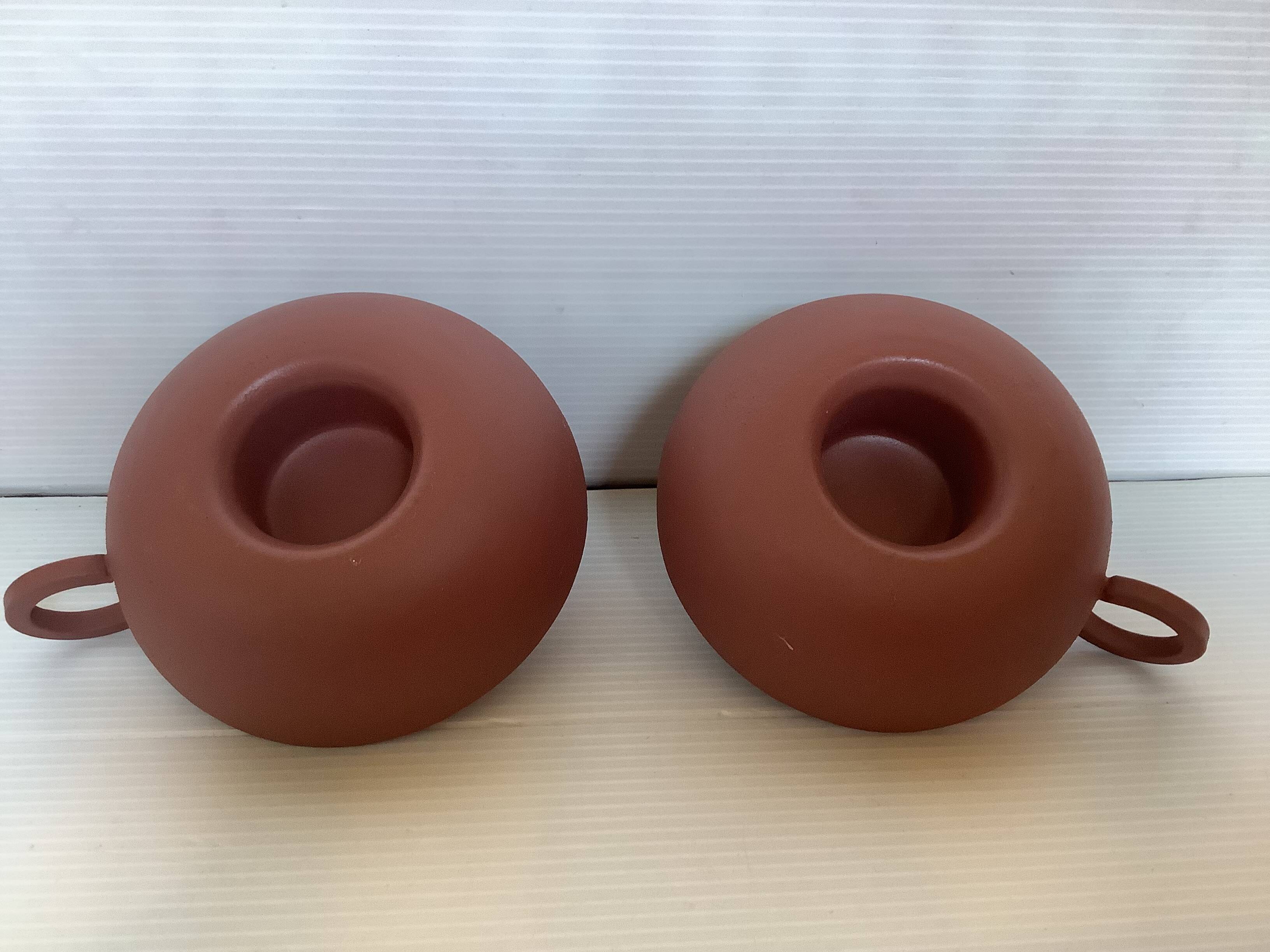 Pair of matte brown ceramic cellar rat candlesticks
