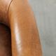 Vintage sheepskin club armchair in a subtle size with warm colours