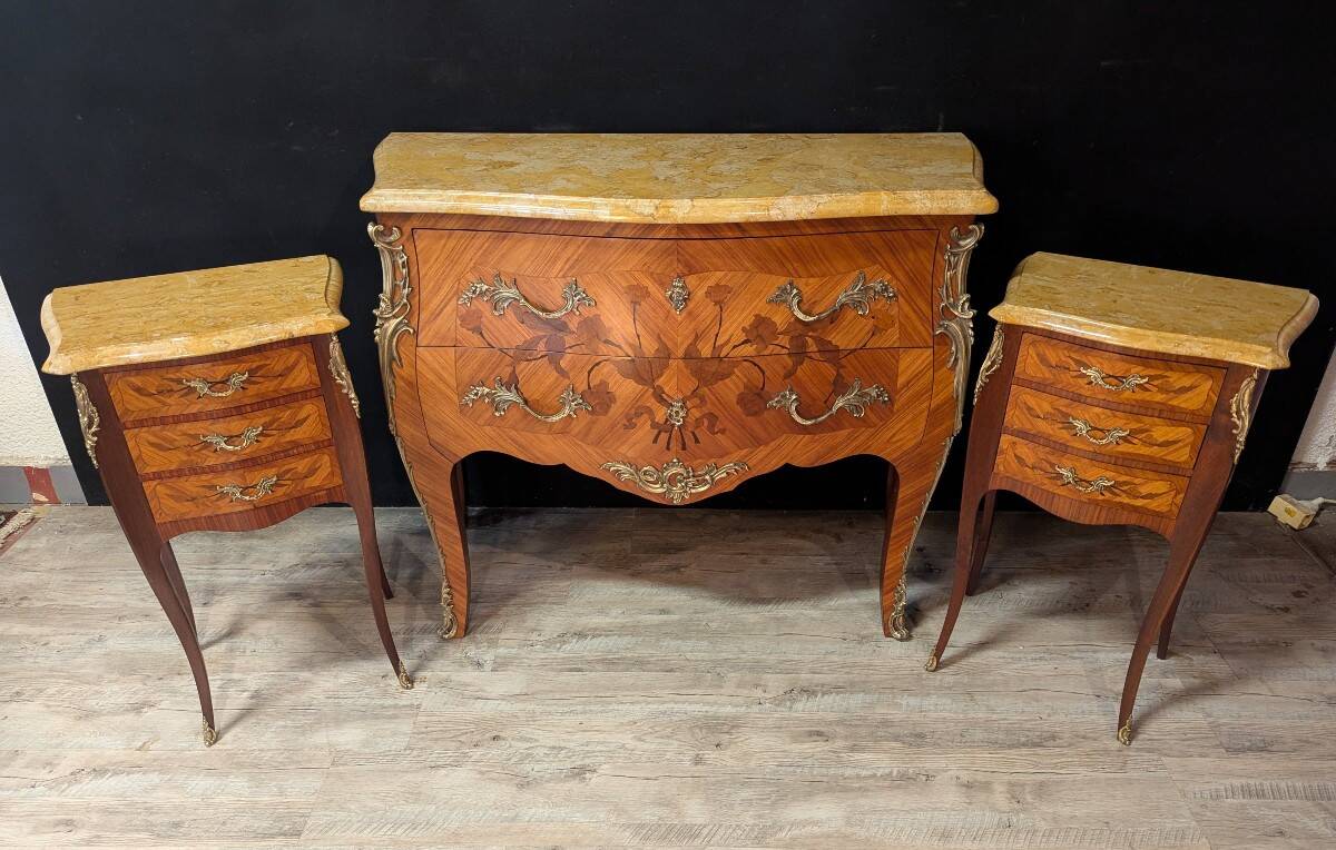 Louis XV style commode with marquetry and its pair of bedside tables.
