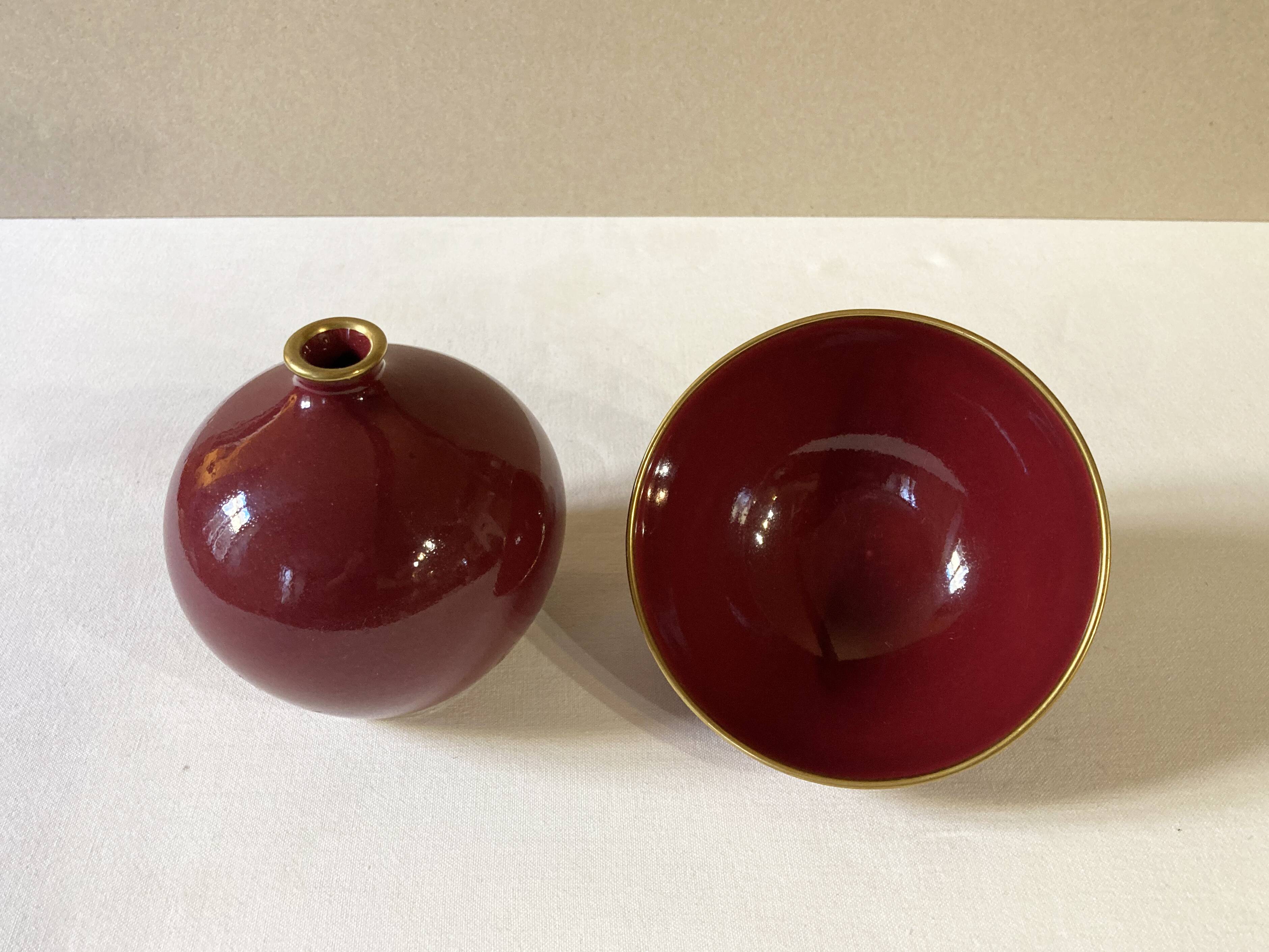 Raspberry-colored ceramic soliflore vase and bowl, enhanced with gilding, Arabia, Finland
