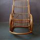 Vintage rocking chair in rattan from the 60s-70s, high openwork backrest.