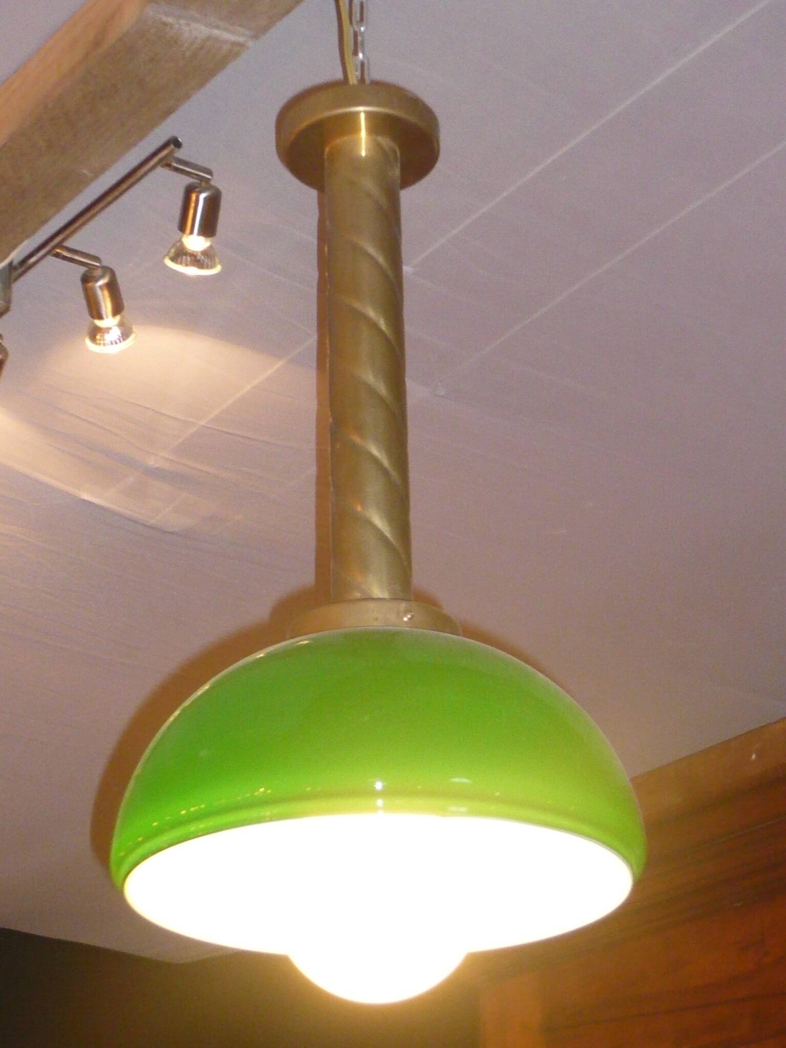 Chandelier with brass body and green opaline
