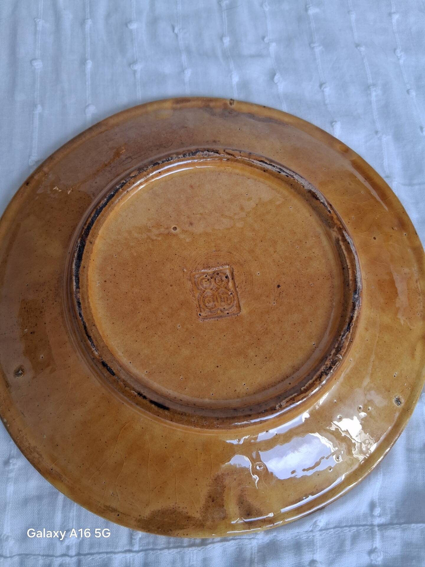 Decorative glazed earthenware plate stamped Biot, 18 cm. Vintage.