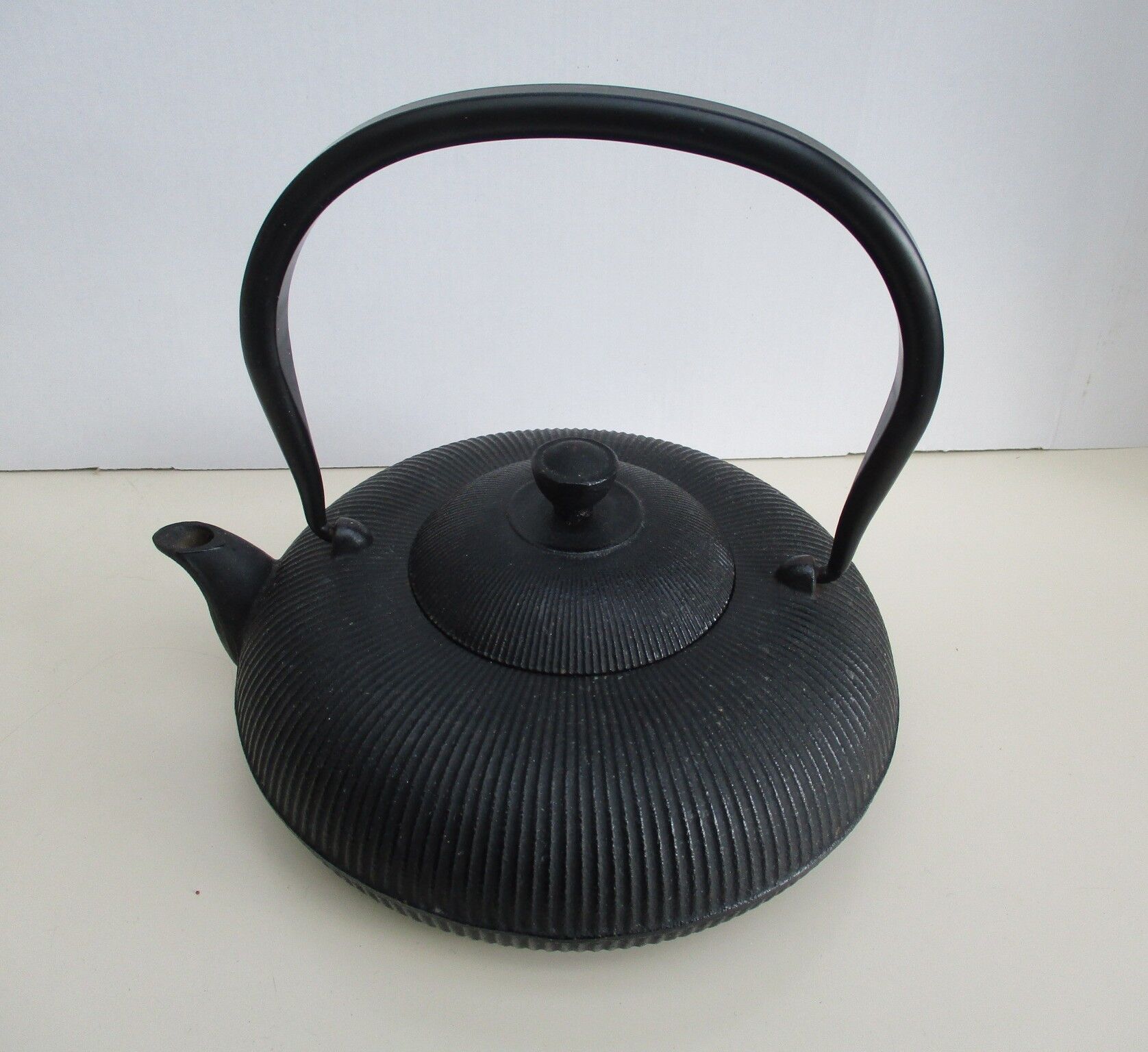 Asian teapot in black cast iron