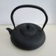 Asian teapot in black cast iron