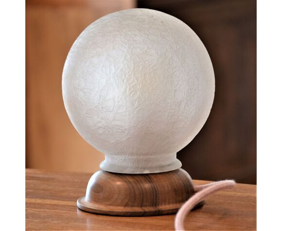 White glass globe table lamp with geometric reliefs