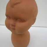 Terracotta vase: child's head