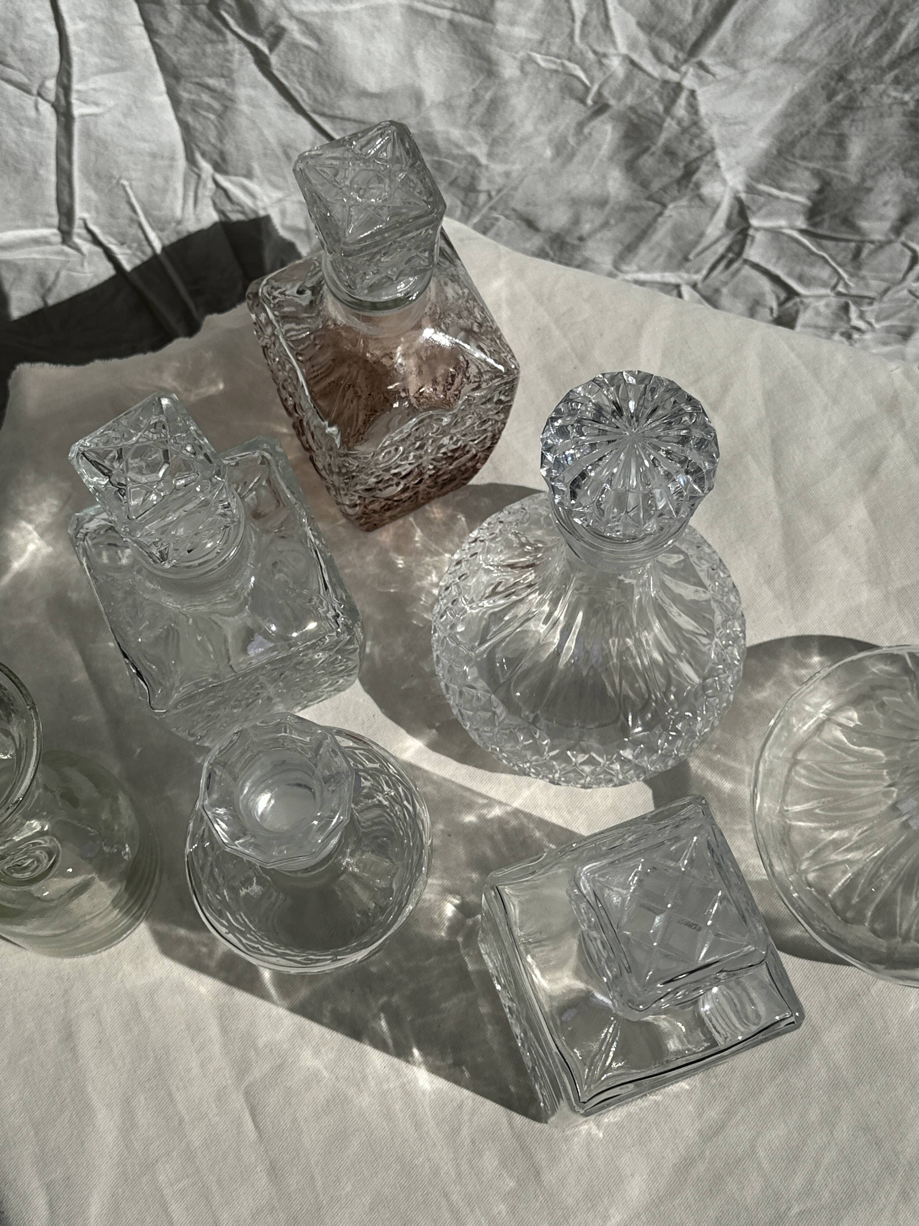 Small cylindrical glass whiskey decanter H:23