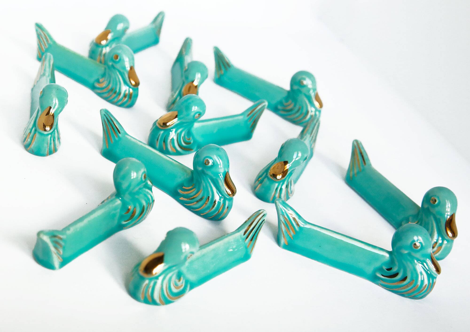 Set of 12 turquoise blue and gold duck knife holders mid-20th century