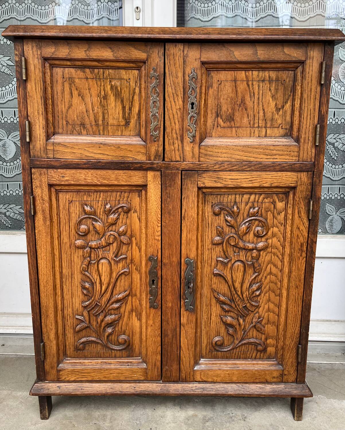 Low carved wooden sideboard