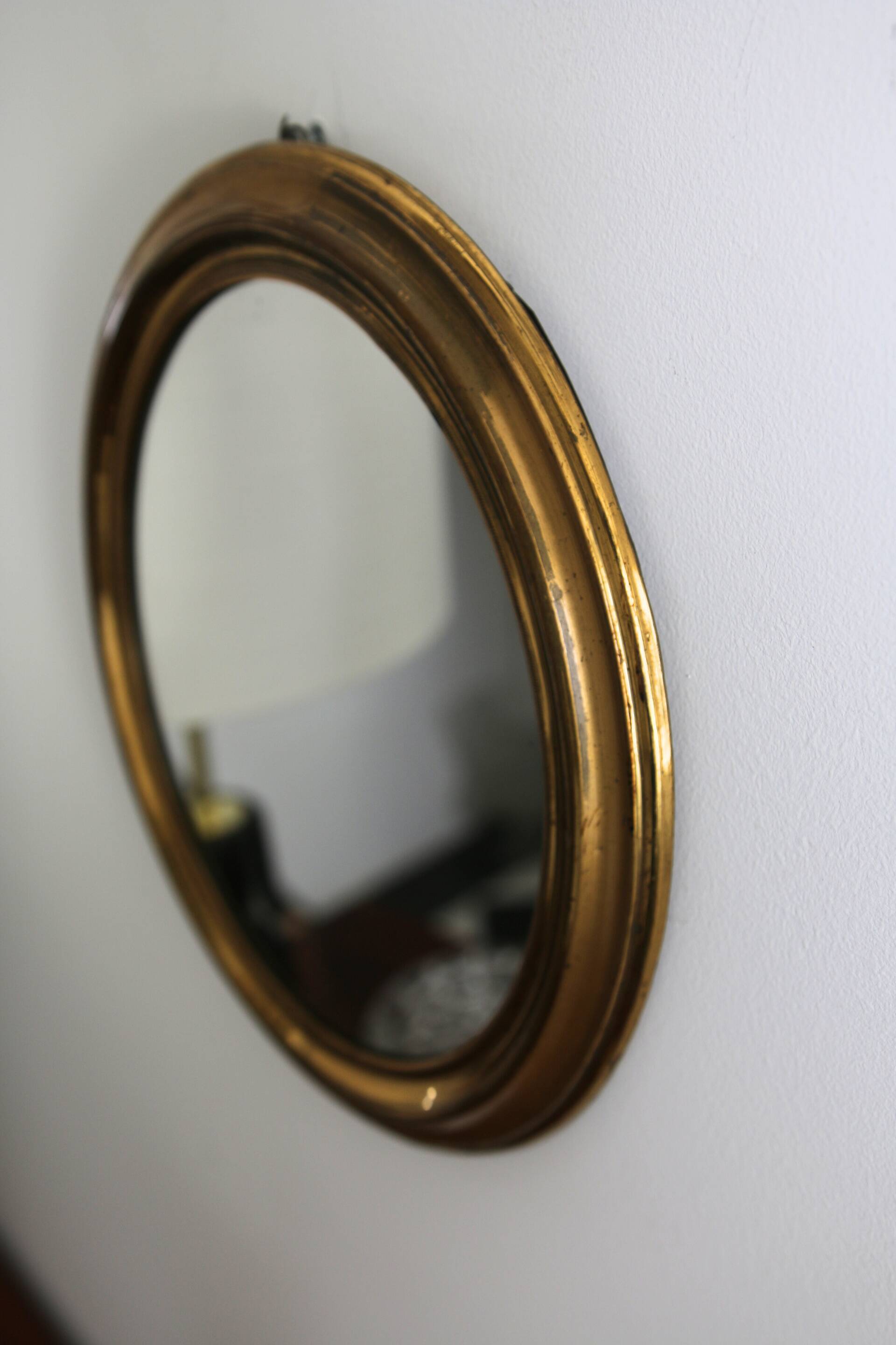 Oval brass mirror