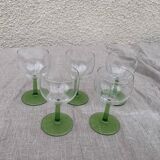 5 transparent glass glasses and green glass vase go