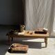 Small stool, footrest in blond teak, organic monoxyle with cut corners.