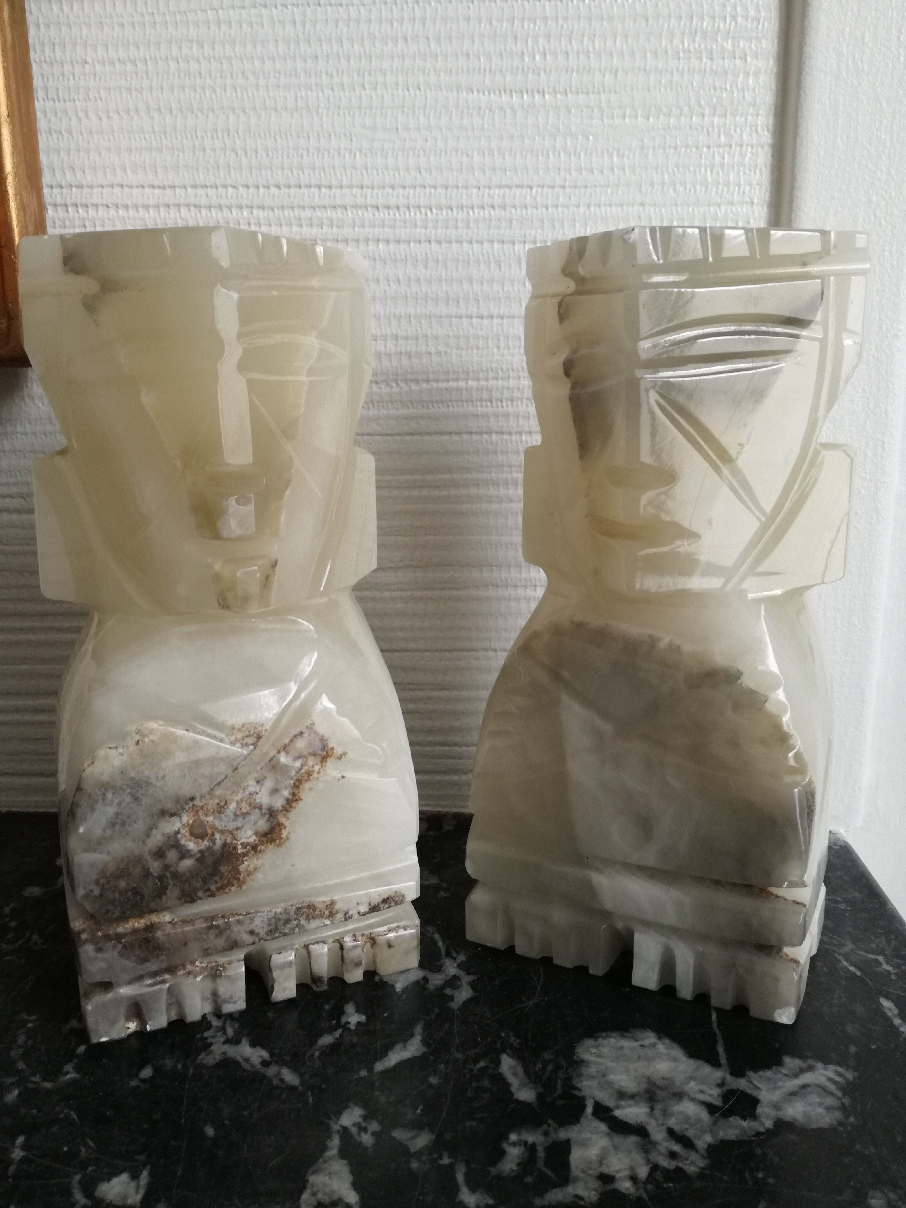Onyx book clambands depicting an Aztec statue