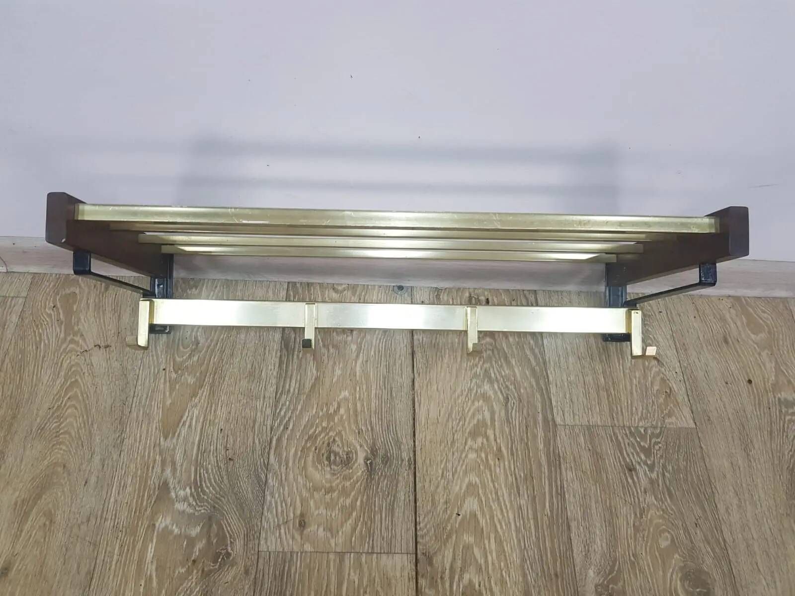 Wall-mounted coat rack, rosewood, gold-tone brass, Austria, 1960s.