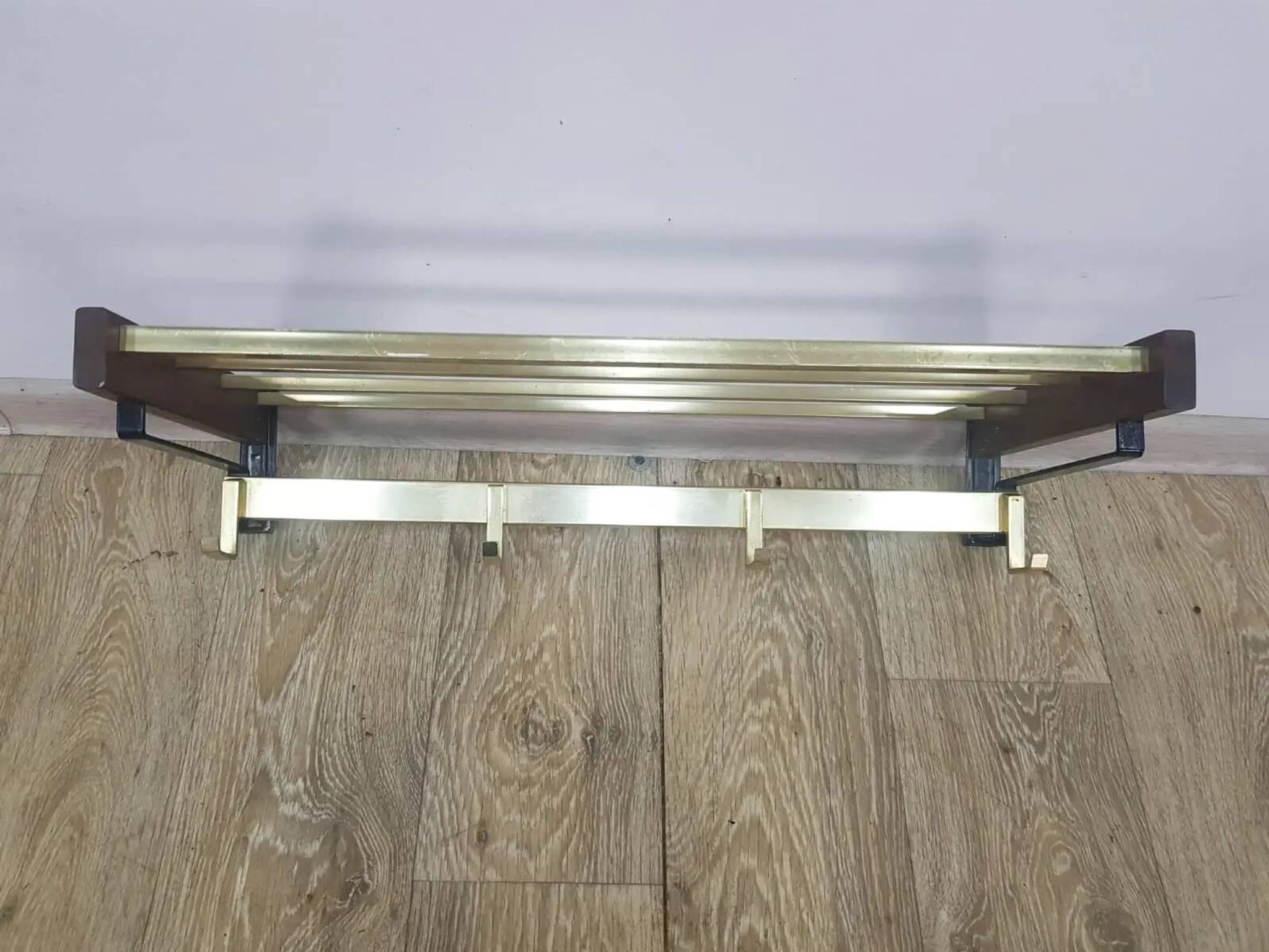 Wall-mounted coat rack, rosewood, gold-tone brass, Austria, 1960s.