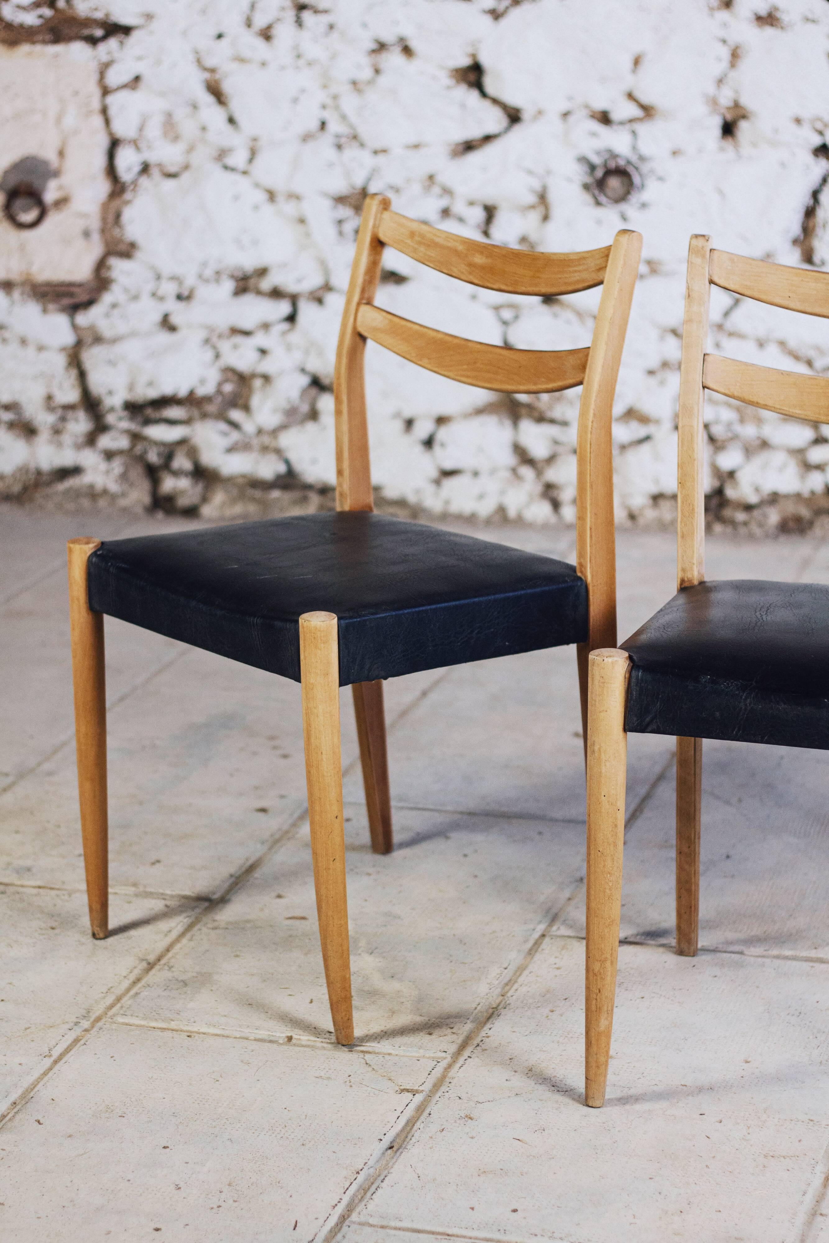 Pair of Scandinavian chairs in teak and faux leather, 1960.