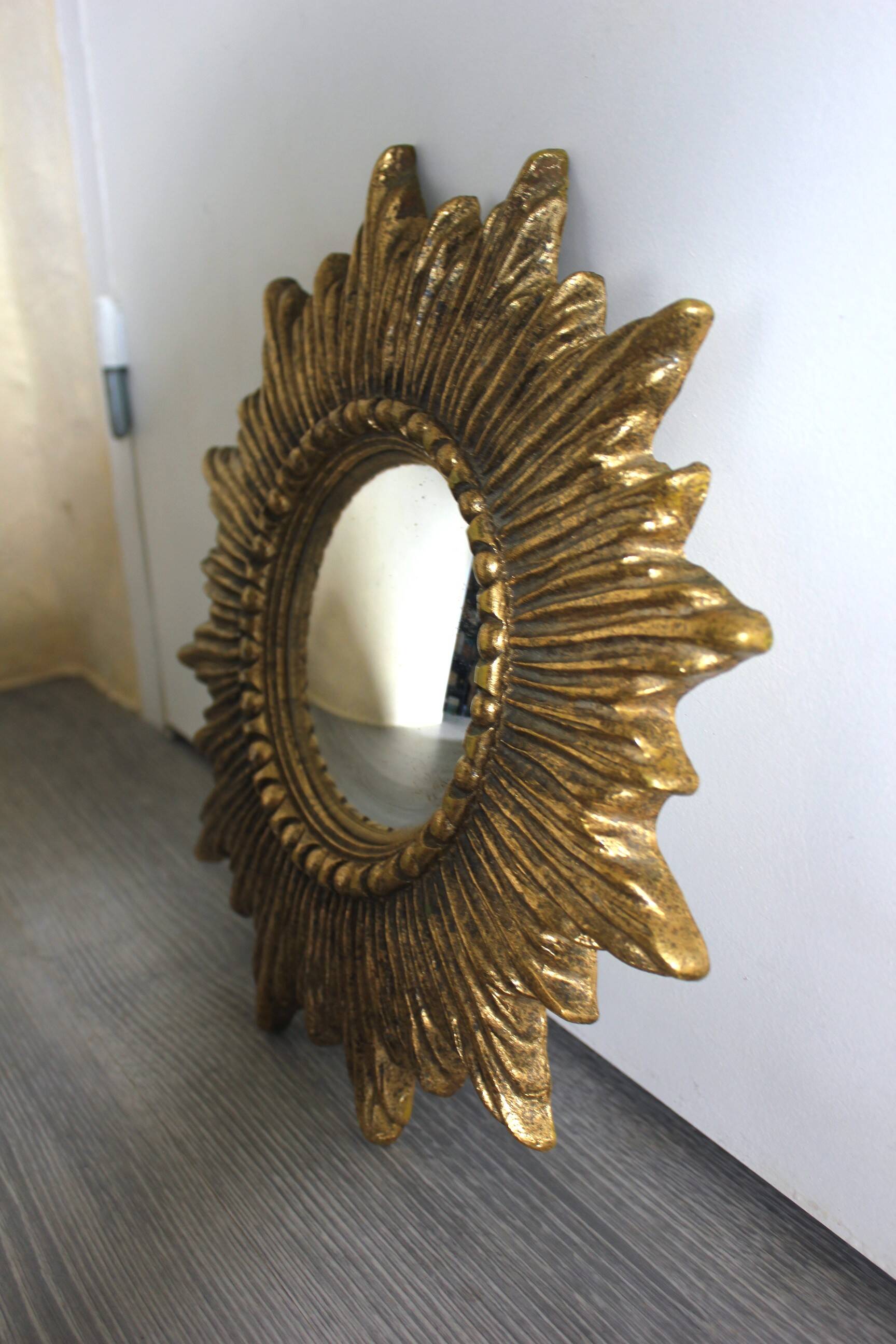 Golden sunburst convex vintage mirror from the 1960s.
